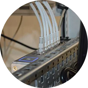 LAN cables and a network switcher representing Sakura Mobile Japan fiber internet support services.