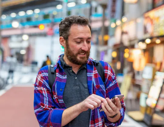 Man using his phone in Japan.