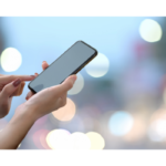 Man with luggage walking through an arch